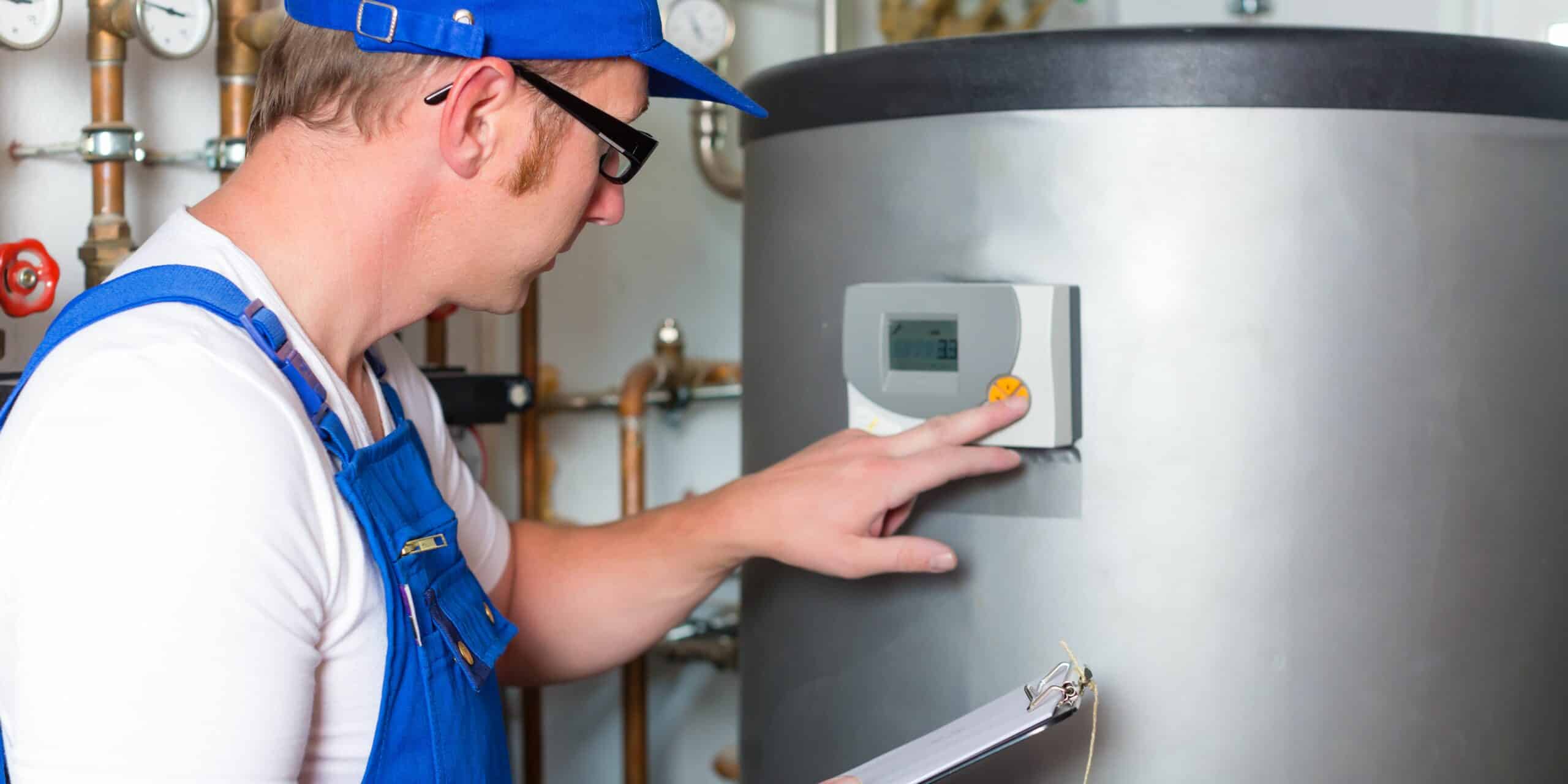 Man checking water tank temperature